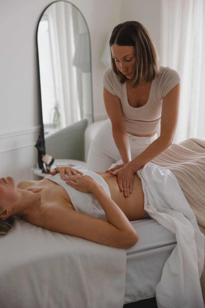 Therapist performing manual lymphatic drainage treatment